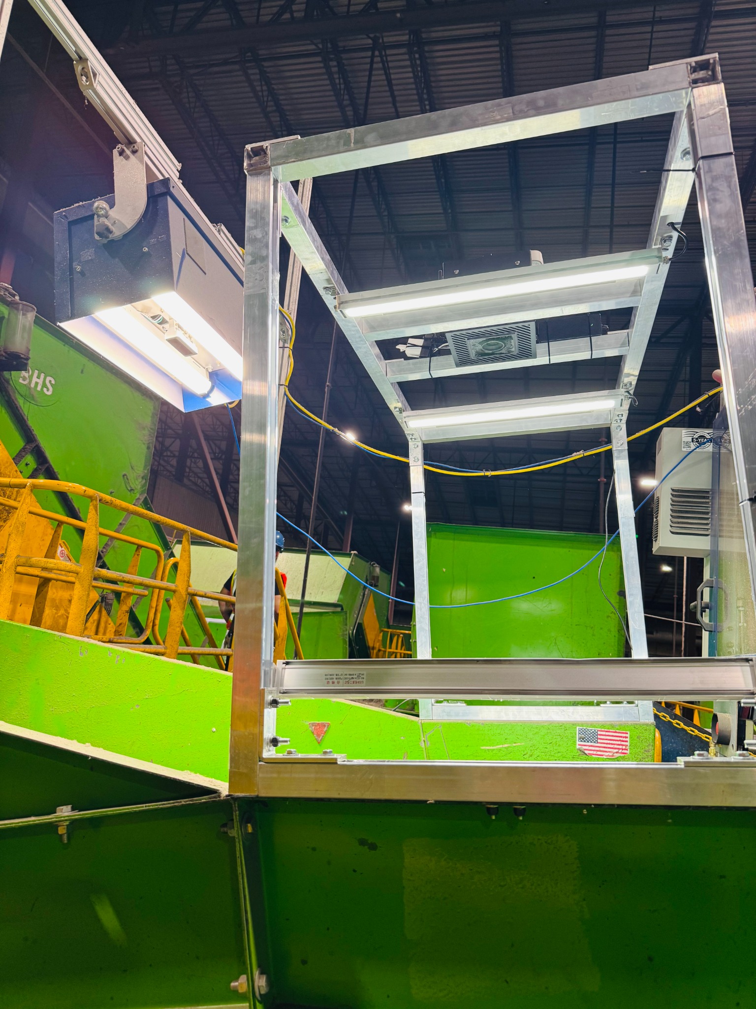 Actual Oscar Meter installation mounted above a conveyor with integrated lighting
